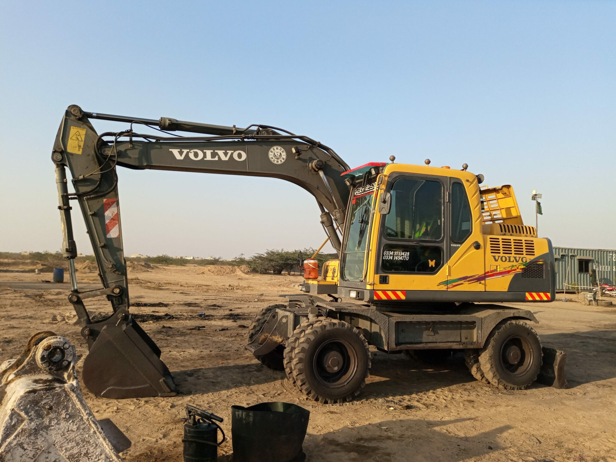 A,Yellow colored,,Volvo,Wheel,Excavator,At,A,Site, ,Karachi