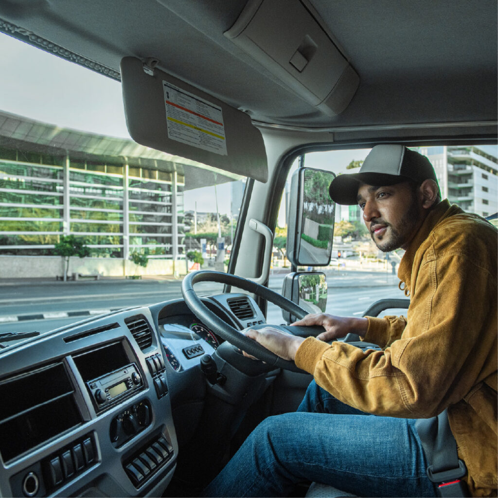 driver inside the UD truck cabin