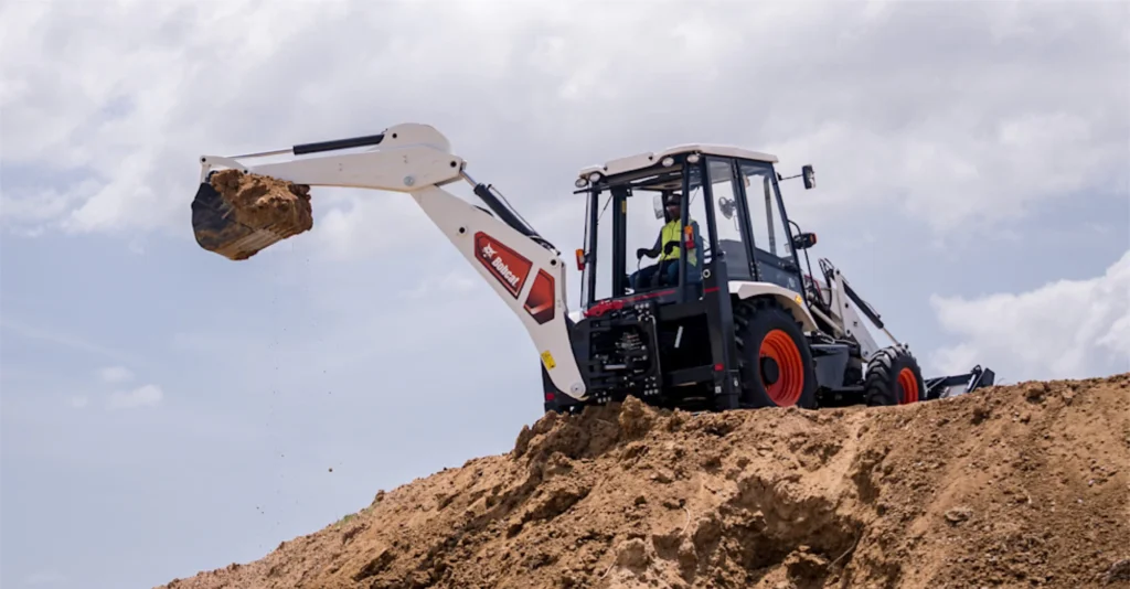 bobcat backhoe loader operator is digging using backhoe