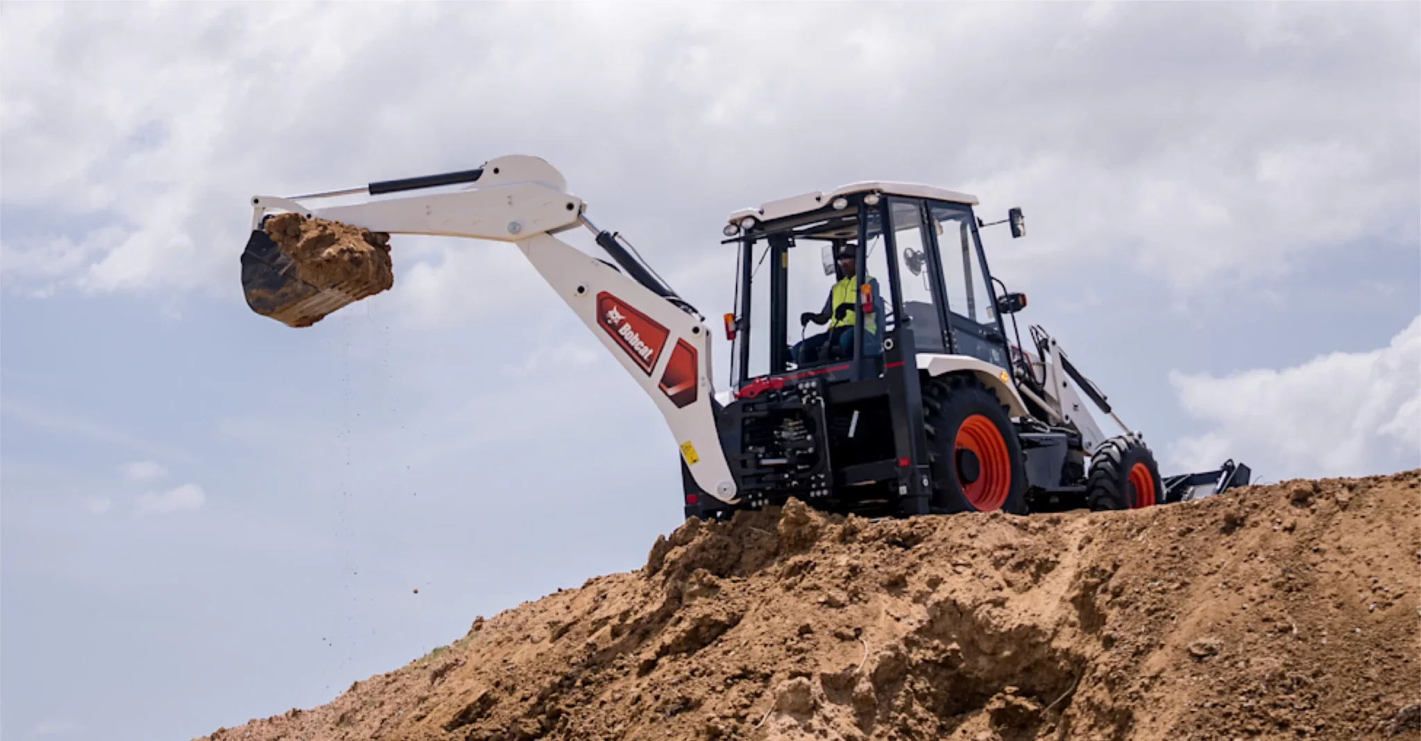 bobcat backhoe loader operator is digging using backhoe