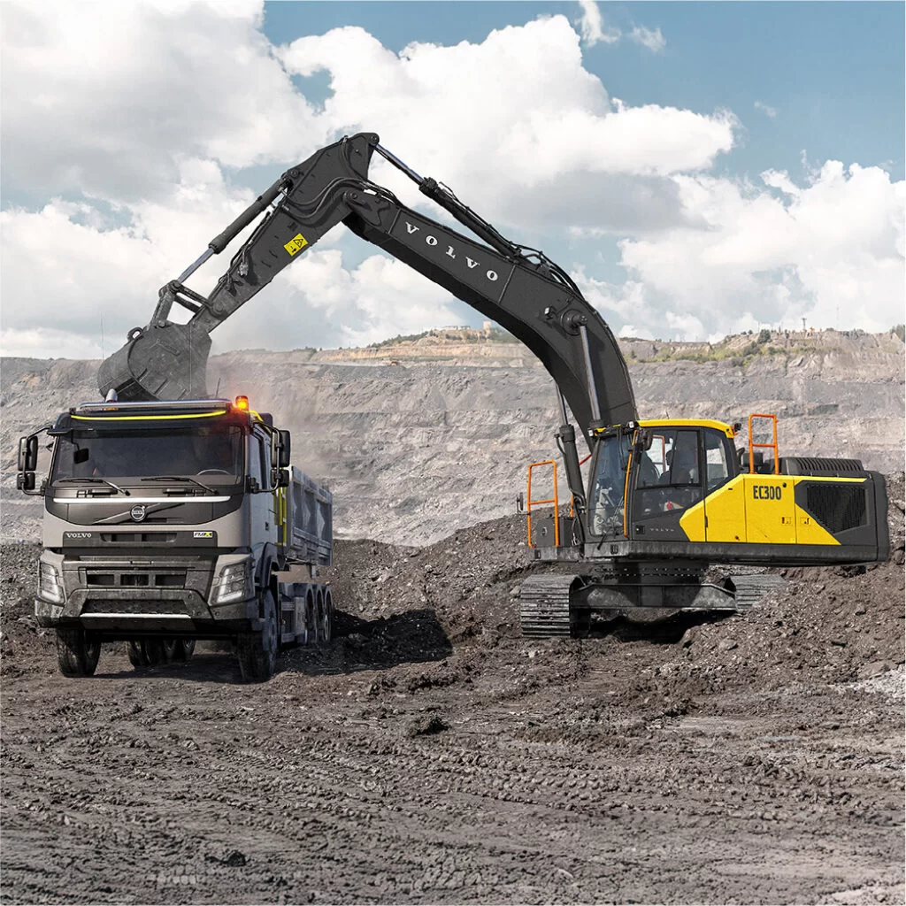 volvo ec300 in the quarry with volvo truck