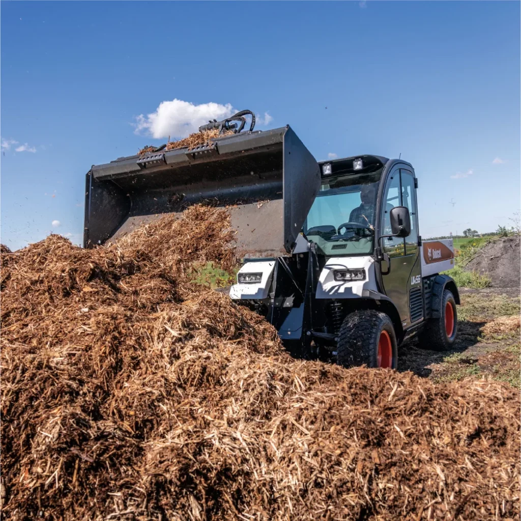 bobcat UW56 toolcat in bucket attachment with hay