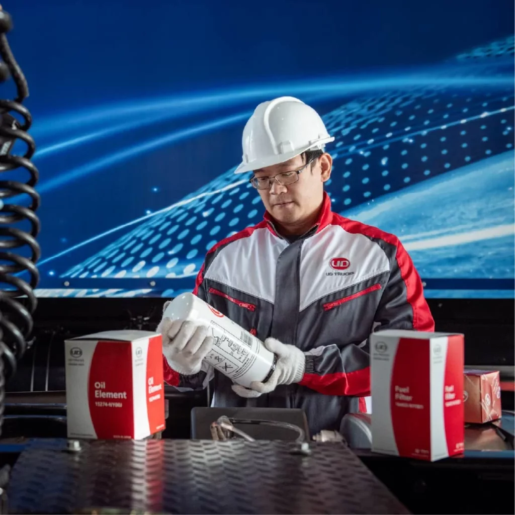 technician holding ud genuine parts