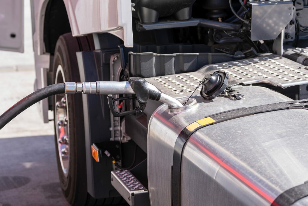 a truck being filled in with fuel