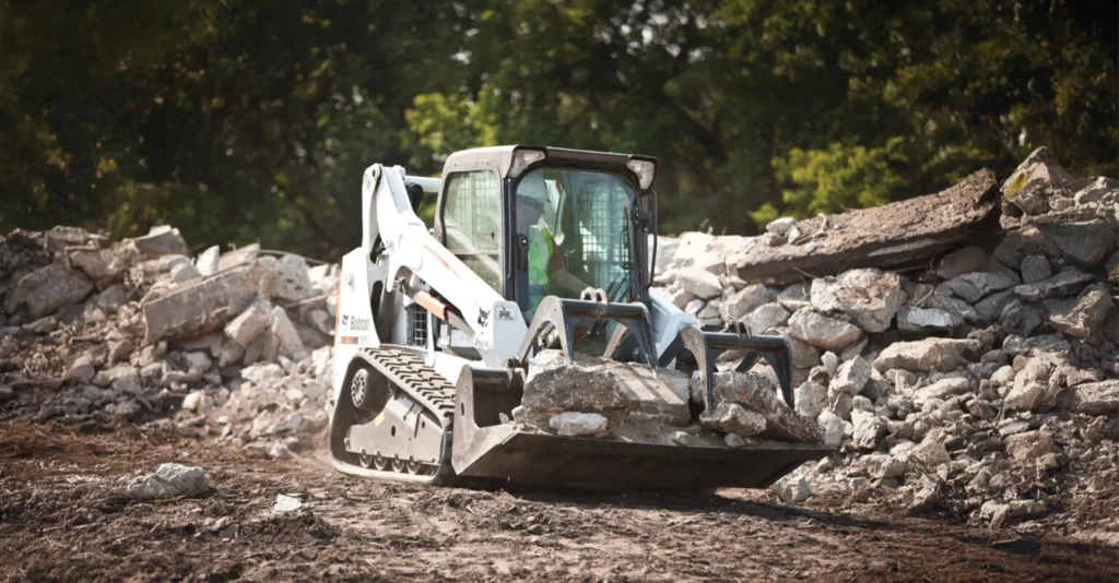 bobcat compact track loader T590 carrying rocks