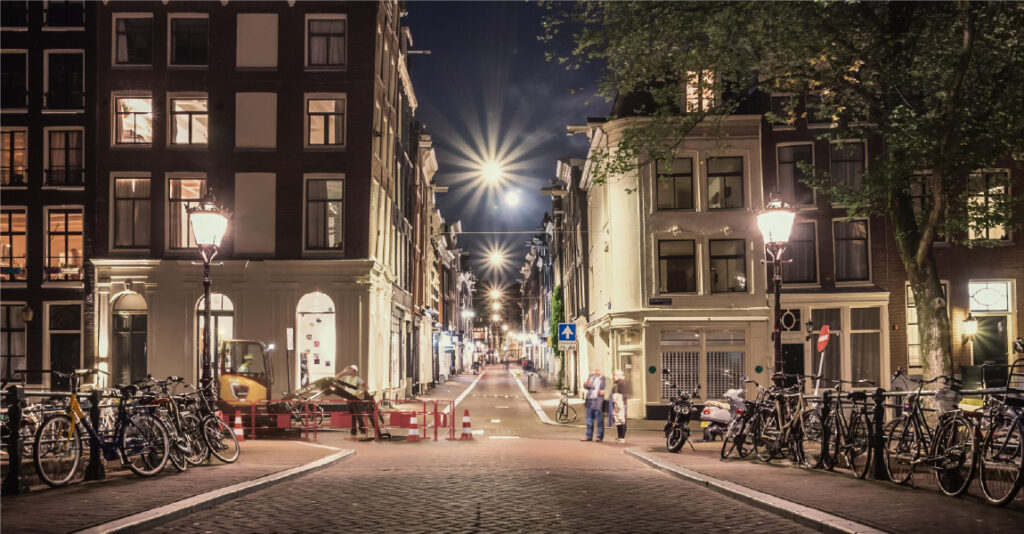 volvo electric machine working in city at night