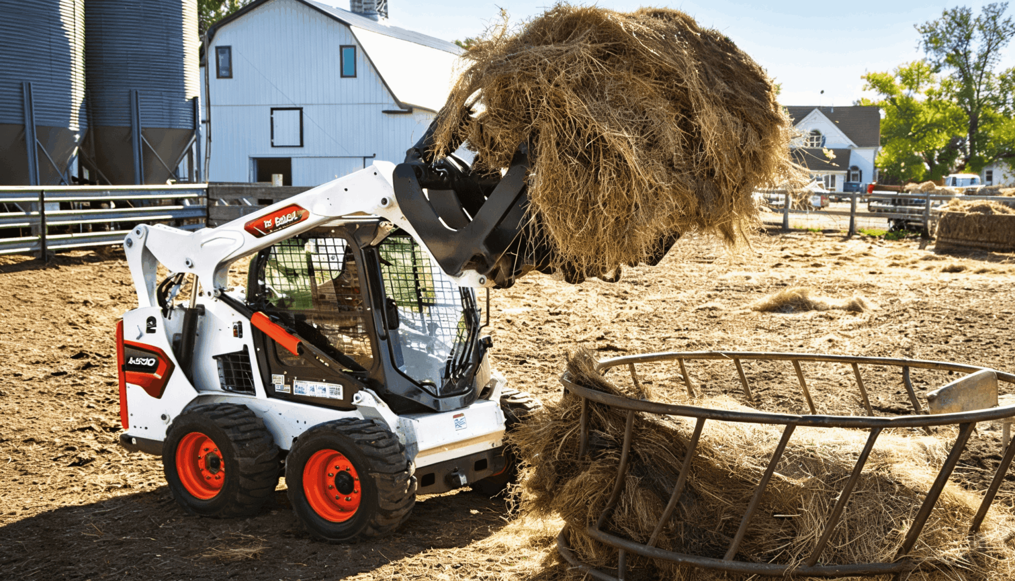 Bobcat skid steer loader lifting a large hay bale with a grapple attachment on a farm
